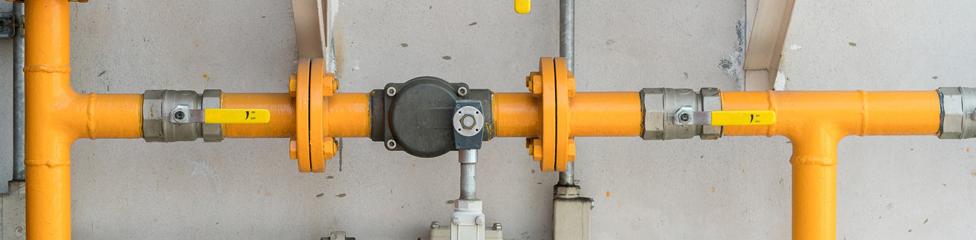 Yellow Gas Pipes in front of Concrete Wall Western North Carolina